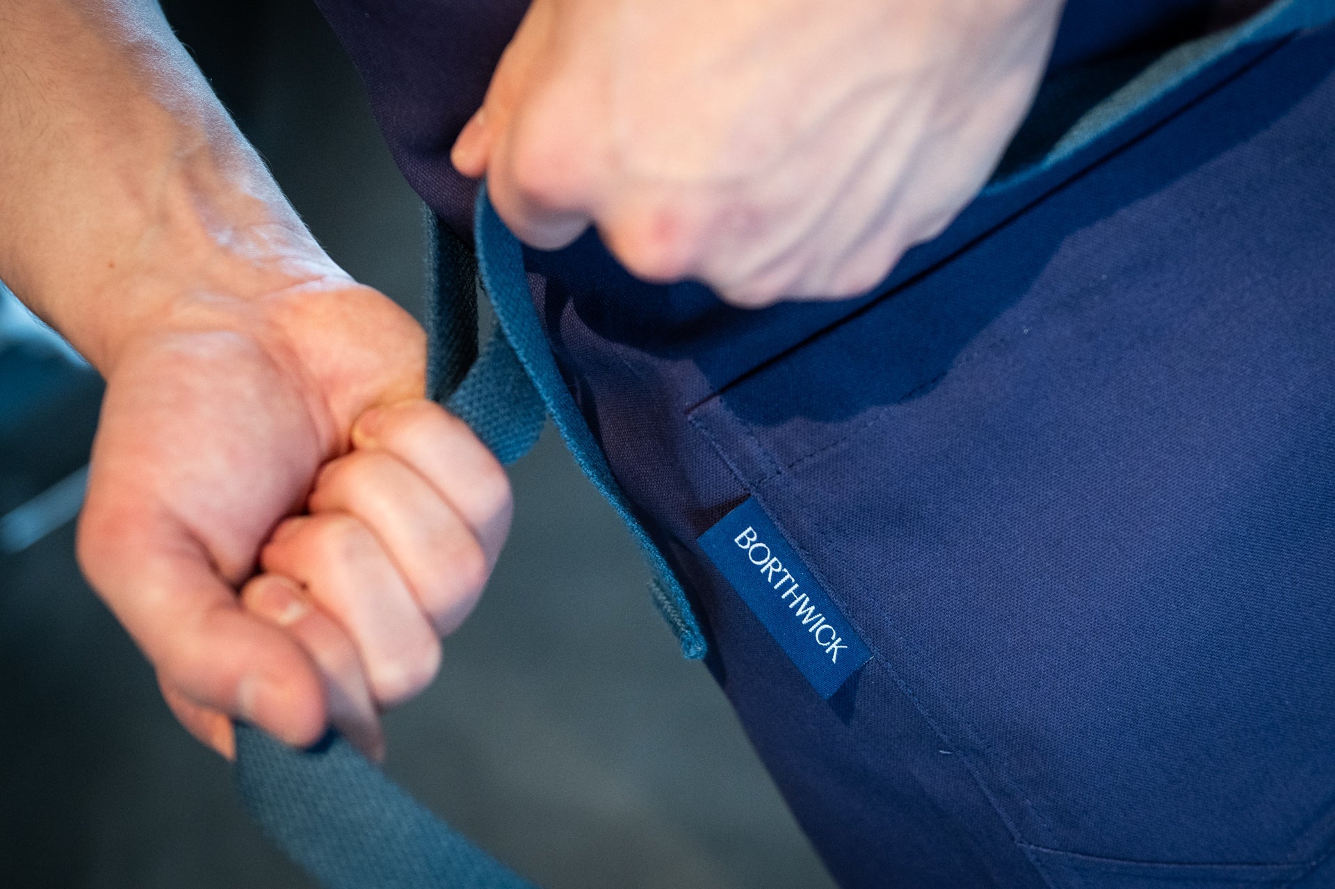 close up view of  the navy staples apron